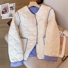 A woman wearing a plaid panel parka with a zip-up front.