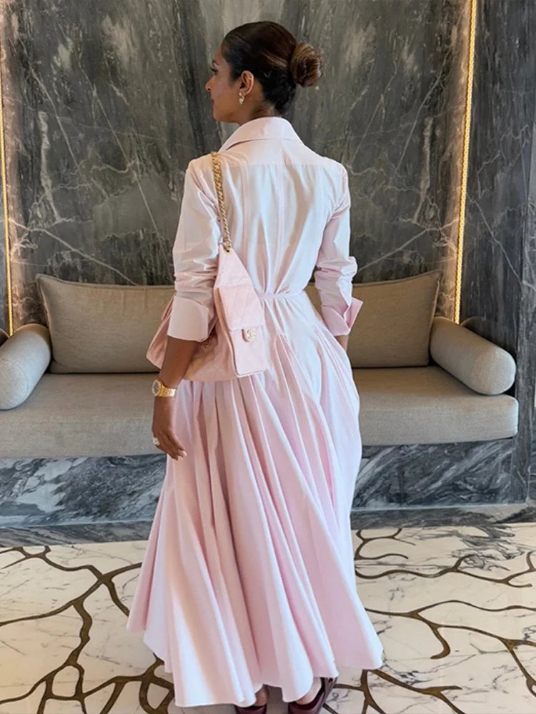 The full length of the pleated A-line skirt set, showing its elegant movement.