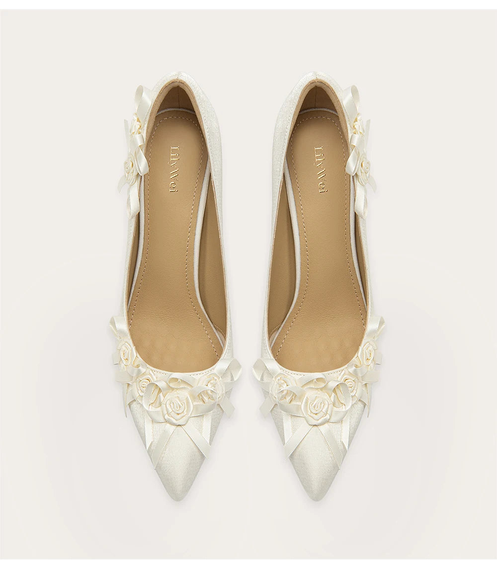 Elegant high heel pumps featuring handmade flower details