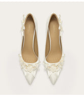 Elegant high heel pumps featuring handmade flower details