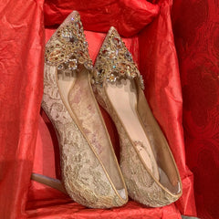 Pointed toe gold party pumps with ornate crystal toe details