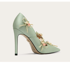 Pointed toe mint green high heel shown for a banquet and spring party looks on a light grey background