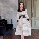 Polka dot belted midi office dress styled for elegant work and brunch looks