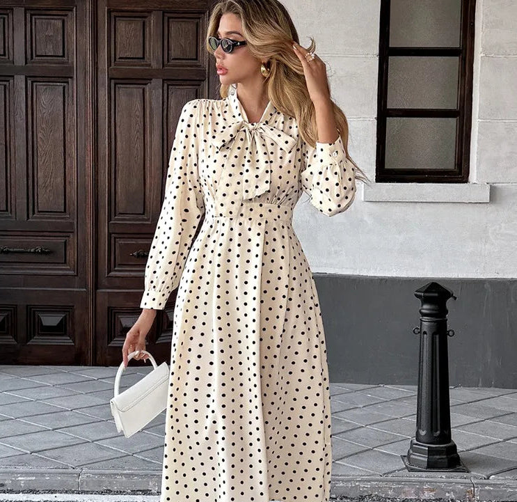 Polka dot dress with bow-tie V-neck and long sleeves