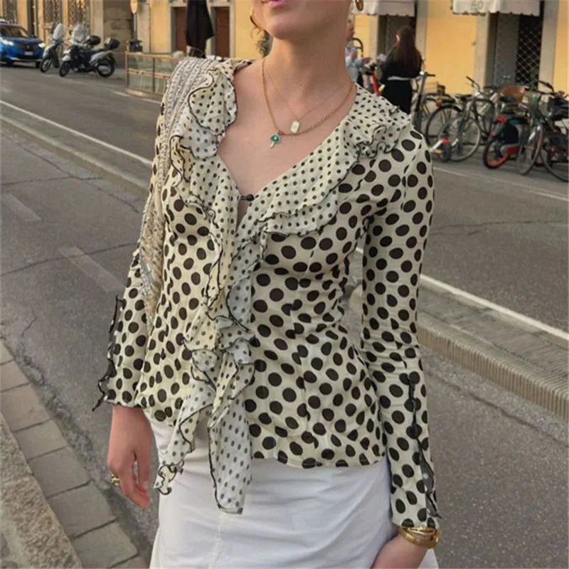 Woman wearing polka dot frill long sleeve slim fit blouse