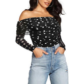 Woman wearing polka dot ruched off shoulder slim fit top