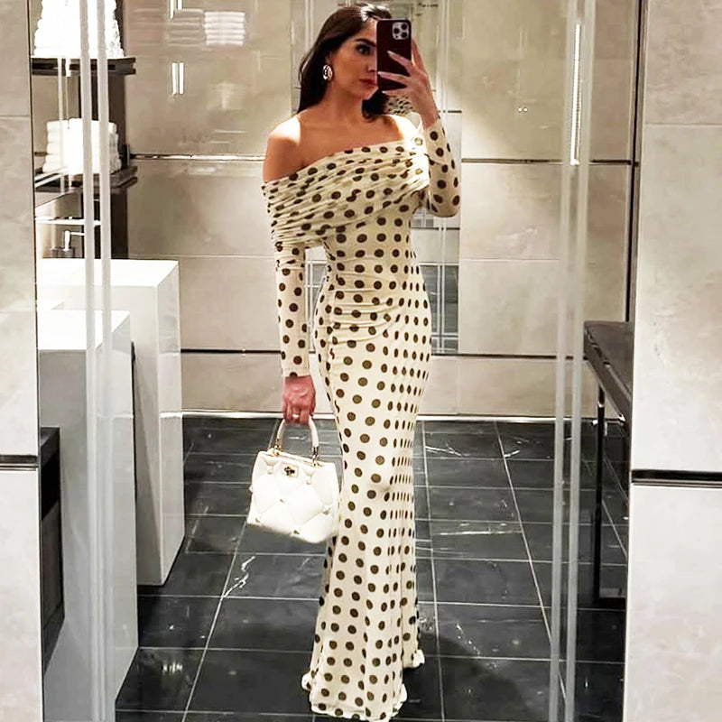 White polka dot slash neck maxi dress styled for city parties