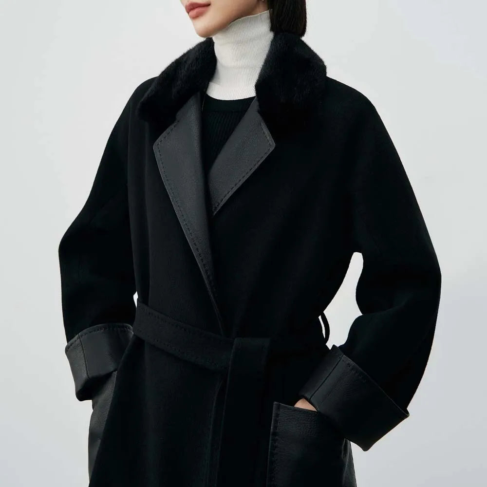 Structured black coat with leather patchwork