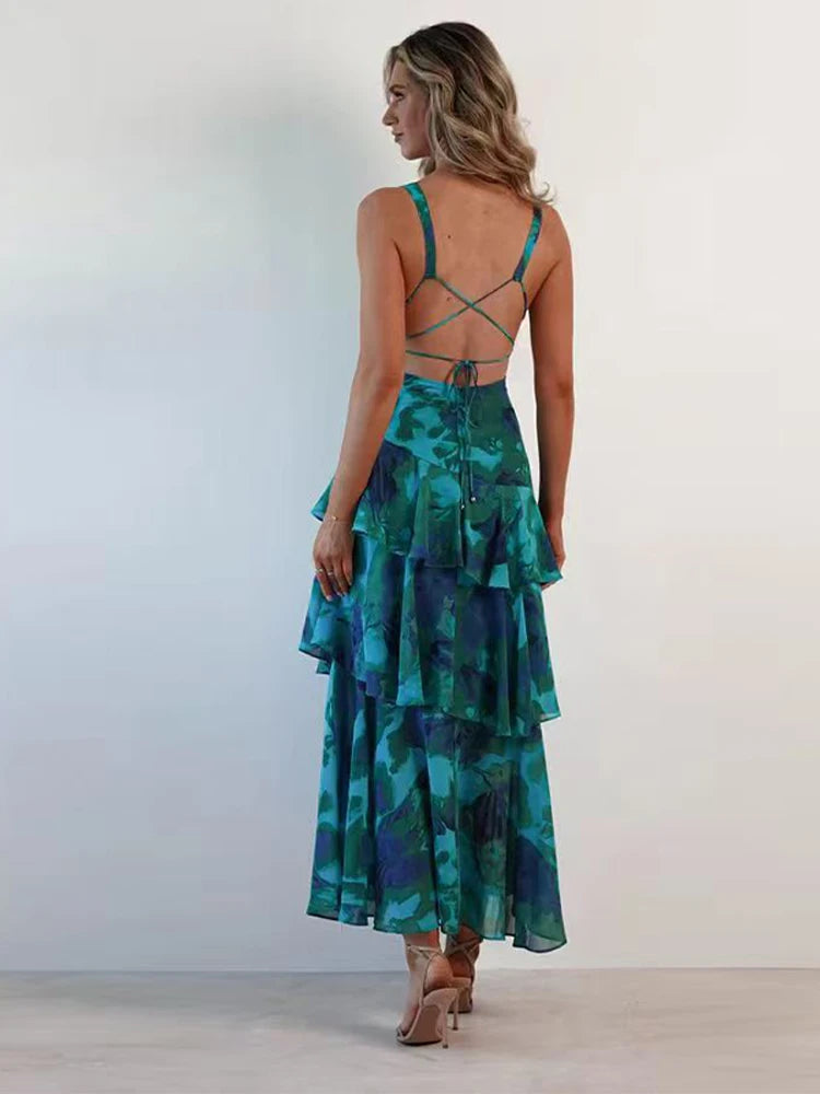 Side view showing flowing tiers on blue printed maxi dress