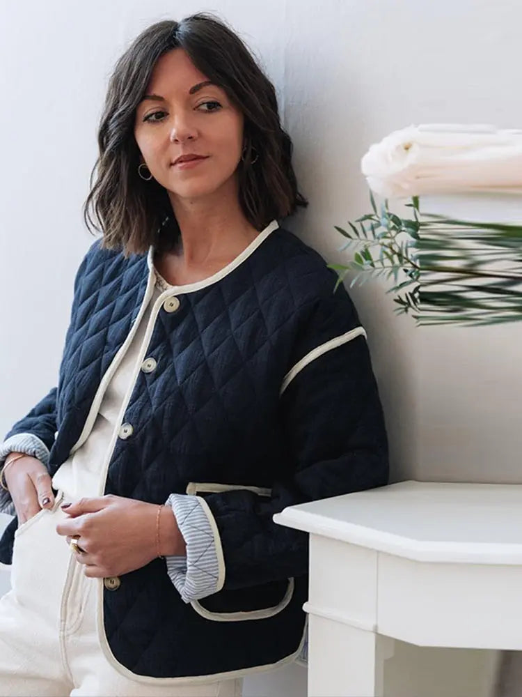 A close-up of the elegant print and the sleek O-neckline.