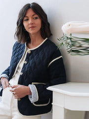 A close-up of the elegant print and the sleek O-neckline.