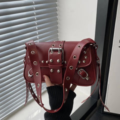 Close view of the flap cover and front hardware, highlighting the structured paneling and polished metal accents on the PU finish.