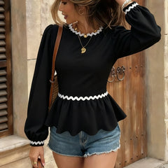 Puff sleeve blouse showing dramatic bow detail for seasonal feminine styling
