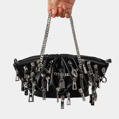 Punk charm moto bucket bag in black with silver chains and key details