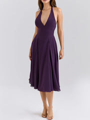 Purple halter neck midi dress styled for modern summer events