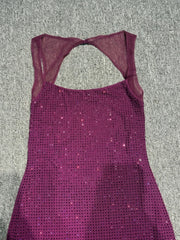Close-up of shimmering rhinestone mesh fabric on purple gala dress