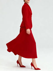 Button-front blazer paired with a high-waist A-line skirt on a studio background