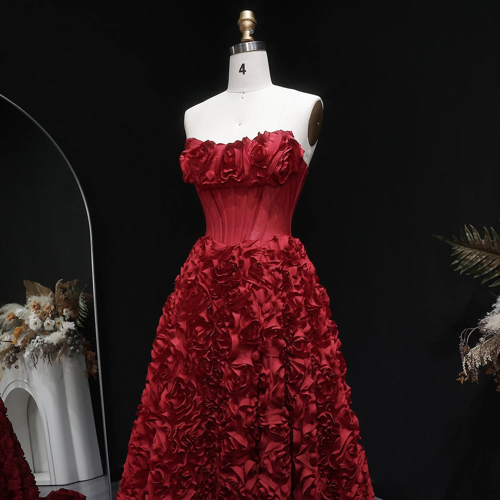 Full-length A-line silhouette with dimensional floral detailing and slit