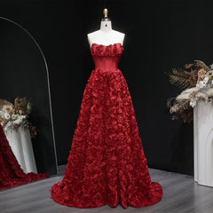 Close-up of floral appliqué texture across the gown’s skirt