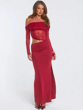 Woman wearing a red lace off-shoulder cut-out maxi dress on a white background