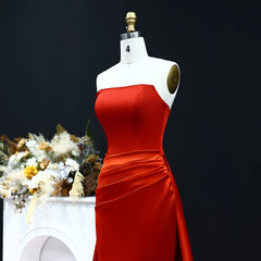 Strapless satin evening gown with sweep train in studio setting