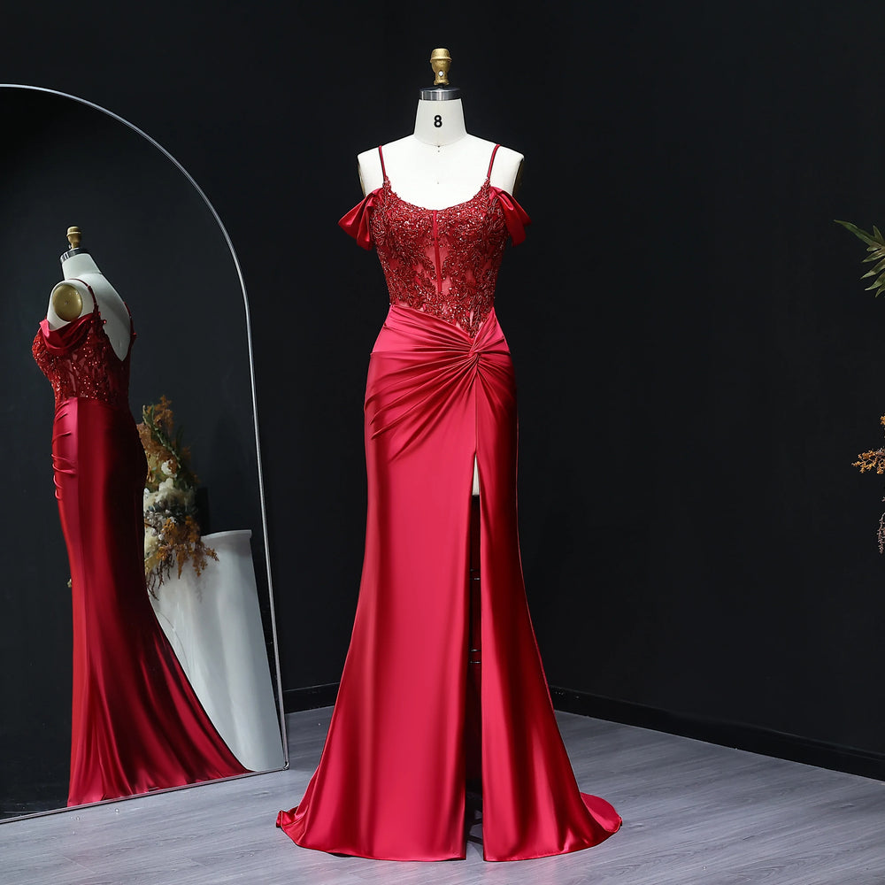 Off-shoulder satin mermaid prom gown with beaded bodice on mannequin