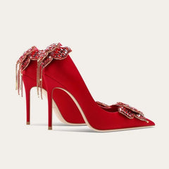 Red silk bow crystal heels with butterfly-knot back and jeweled toe