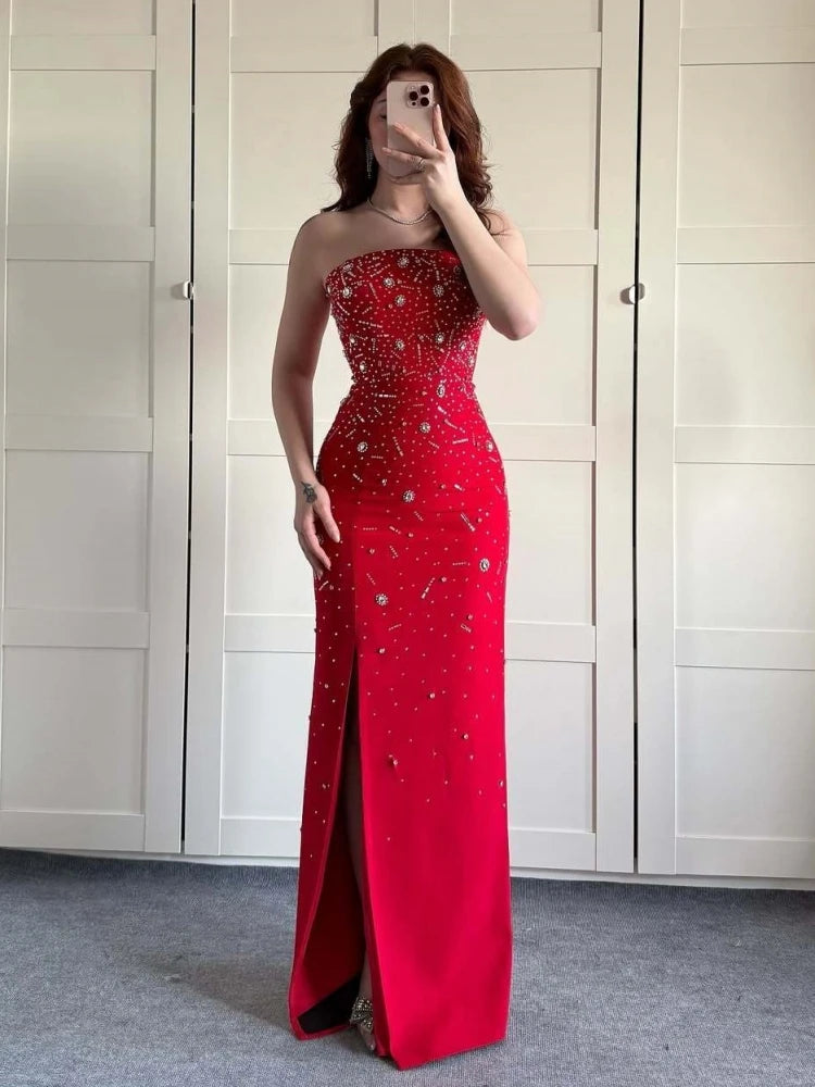 Red strapless beaded gown styled for formal galas and elegant parties