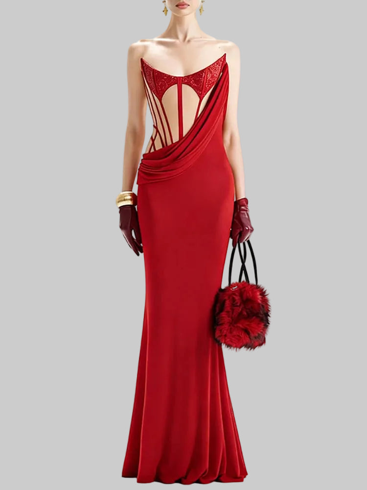 Model in a red strapless long dress on a white background, showing sequin bust detailing and a sleek ankle-length sheath silhouette.