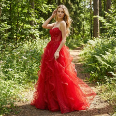 Model wearing a V-neck A-line prom gown with ruffled tulle layers