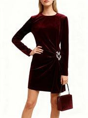 Velvet-finish mini dress featuring a side cutout and accent hardware
