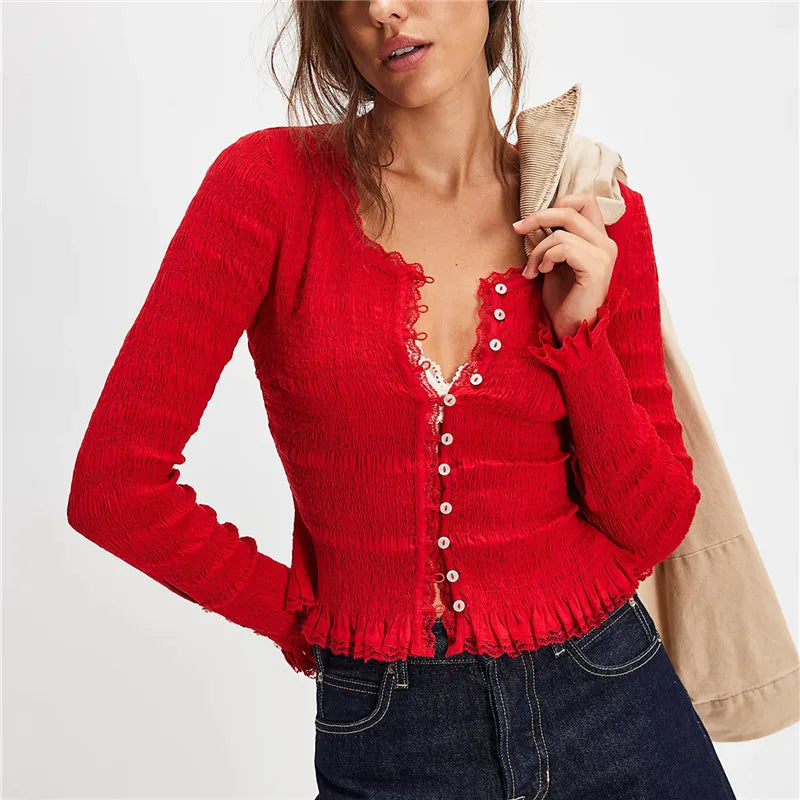 Red v-neck cardigan styled for classic autumn looks with blue denim
