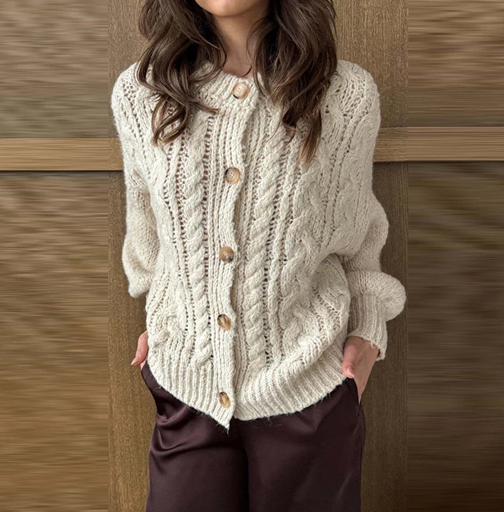 Outfit styling view showing the beige cardigan worn slightly slouched, with roomy sleeves and an easy drape over a minimal base layer.