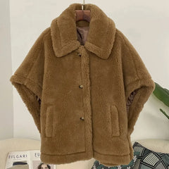 Wide-waisted wool coat displayed front-on, emphasizing its relaxed drape and regular length