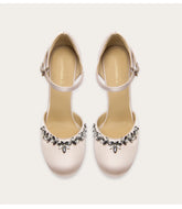 Suede sandals with rhinestone bow and stiletto heel