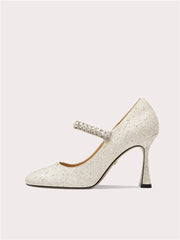 Close-up of rhinestone embellished square toe heels