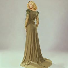 Floor-length formal gown with pleated draping and a sweeping finish