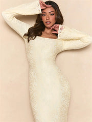 Fabric close-up revealing the smooth texture and gathered ruching of the dress.