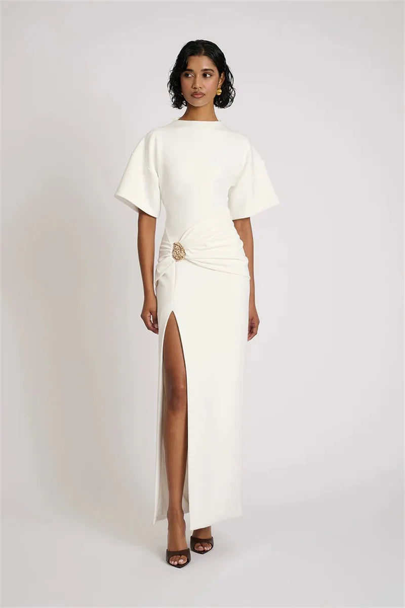 Front view of fitted maxi dress in neutral tone under soft lighting