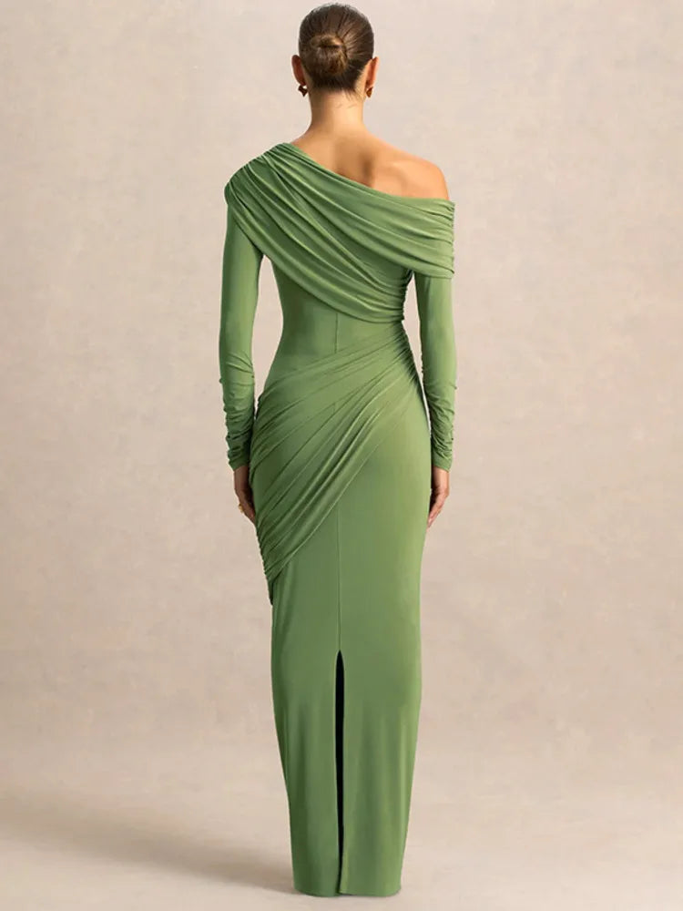 Close-up of asymmetrical neckline and ruched detailing on green dress