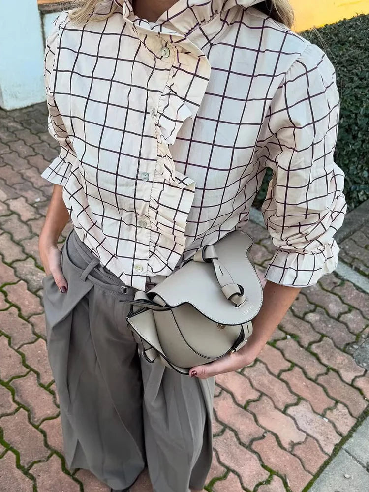 Ruffle detail plaid blouse layered for spring and vintage-inspired looks