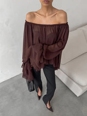 Modern off-shoulder ruffle sleeve top for earthy trend-driven outfits and coffee dates