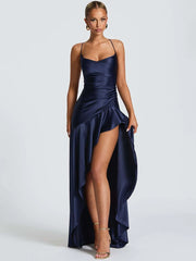 Ruffle split evening gown in blue satin shown for club and party looks on a white background
