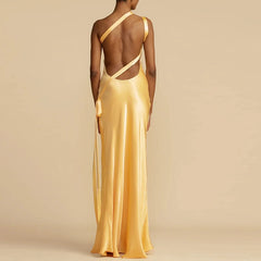 Backless design with cross straps on a satin one-shoulder formal gown