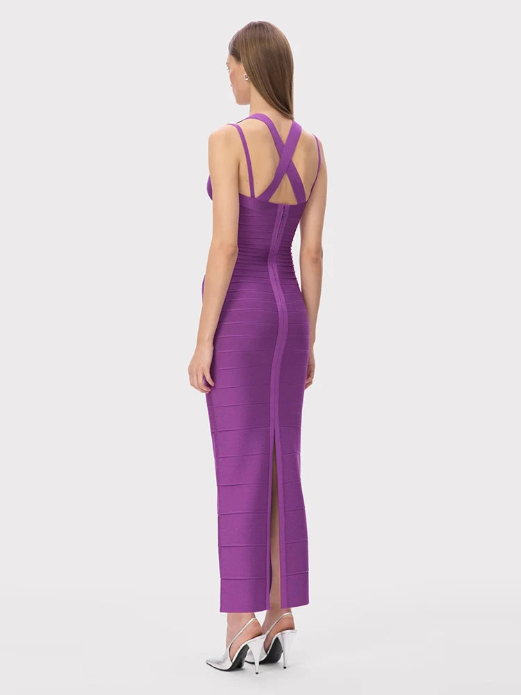 Sculpted purple spaghetti strap gown designed for dramatic holiday entrances