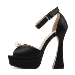 Sculpted strange heel black party shoes for women displayed on white background on a white background.