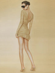 Woman wearing a sculpting cocktail mini dress that smooths the waist with a plain background