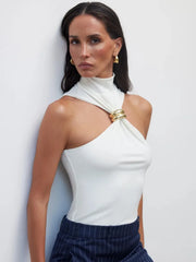 Sculptural knit city top for women shown with white pants