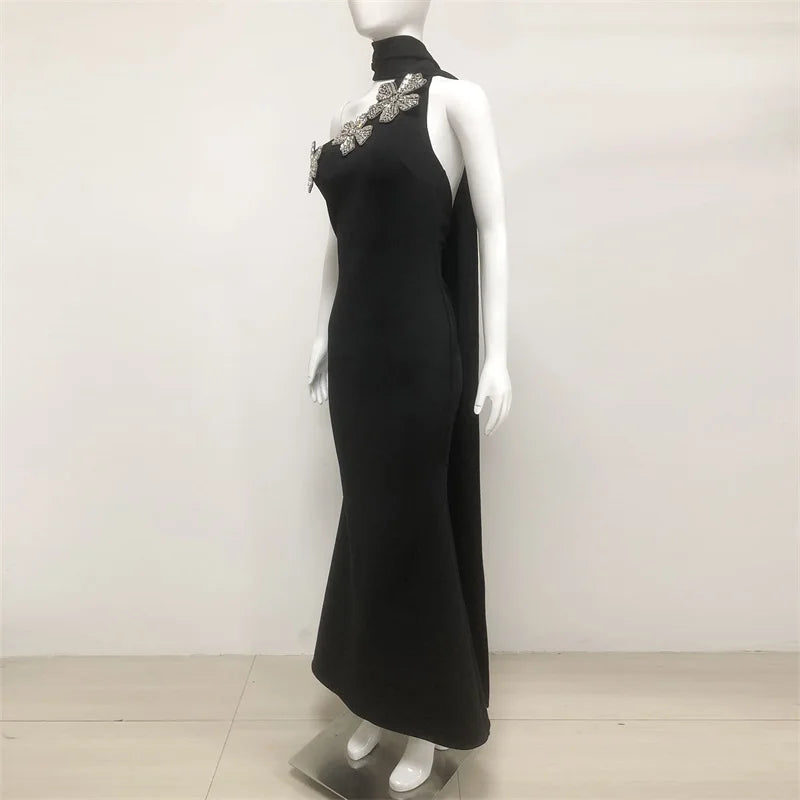 Sculptural scarf black flower gown with runway-inspired accent