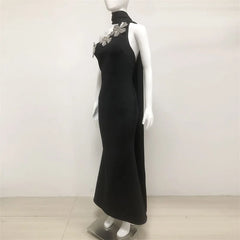 Sculptural scarf black flower gown with runway-inspired accent